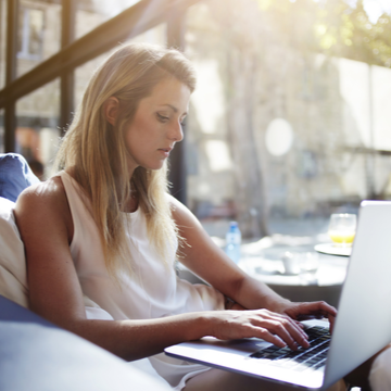 a woman working on her computer