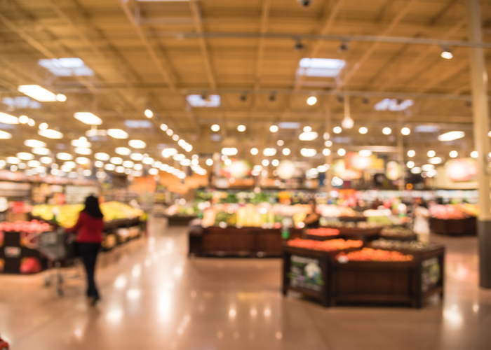 A blurred picture of aisles in a supermarket